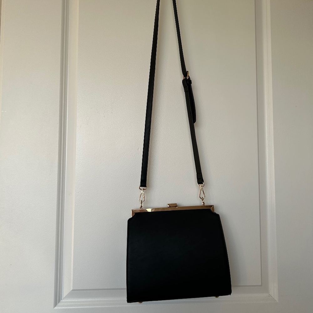 Anthropologie black aota Nicky shoulder bag.
